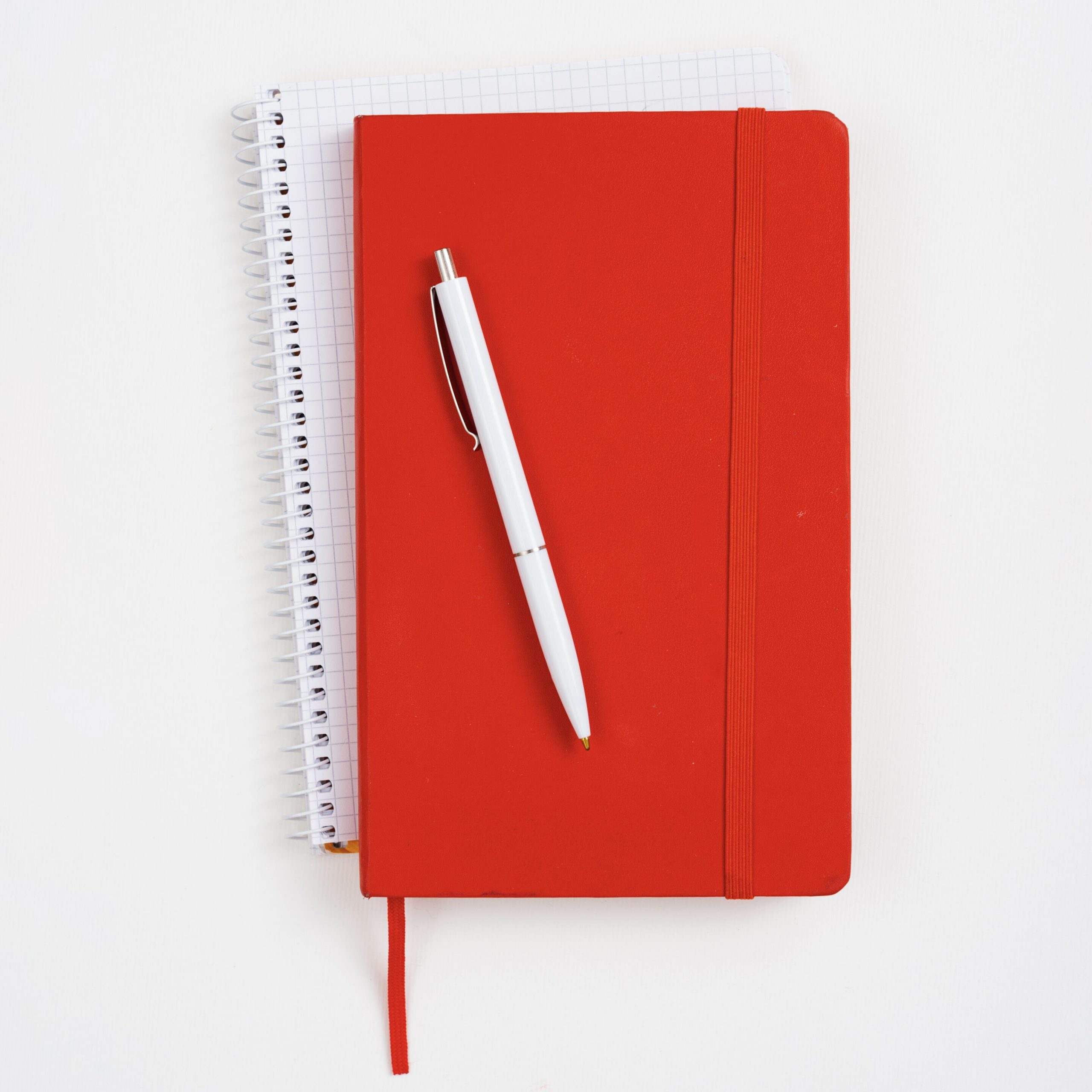 top-view-red-notebook-with-white-background-scaled